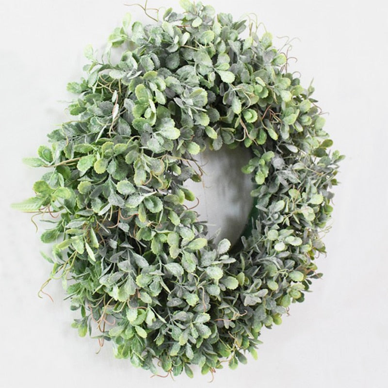 Couronne de feuilles vertes artificielles